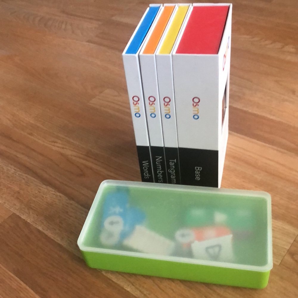 Osmo educational game. Includes iPad base ( Tangram, number, words plus coding)